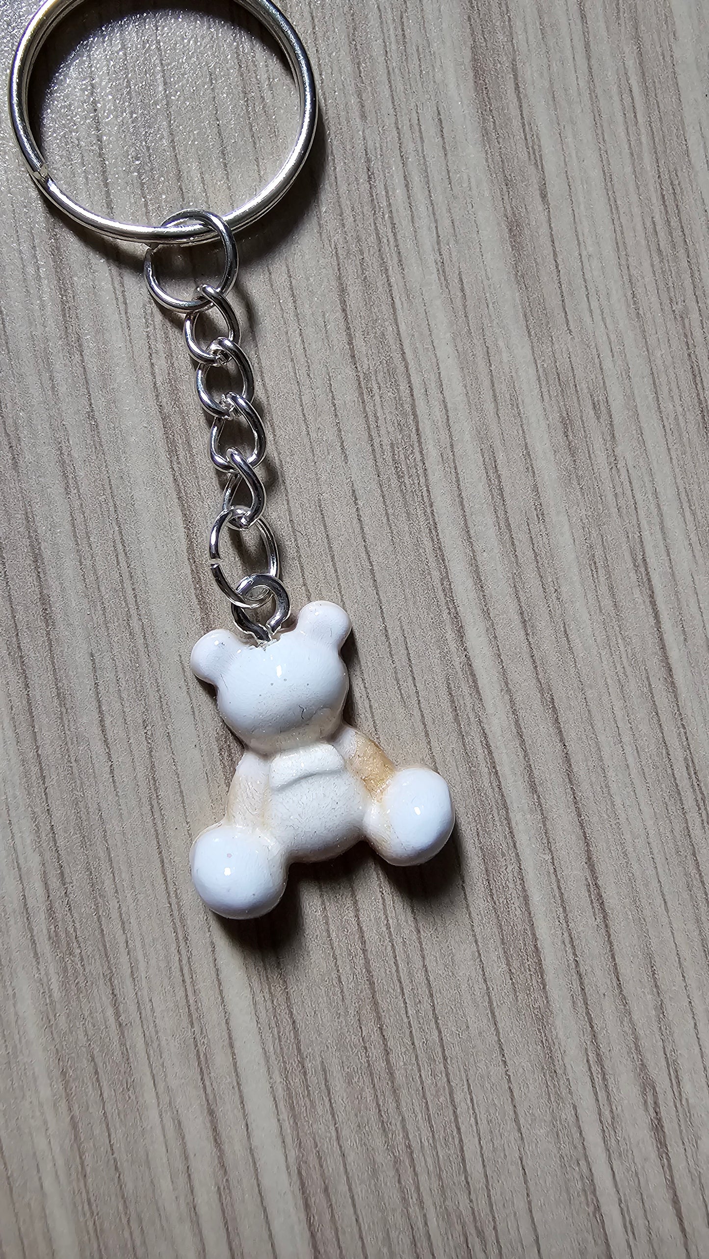 Petit porte clé ourson blanc et doré