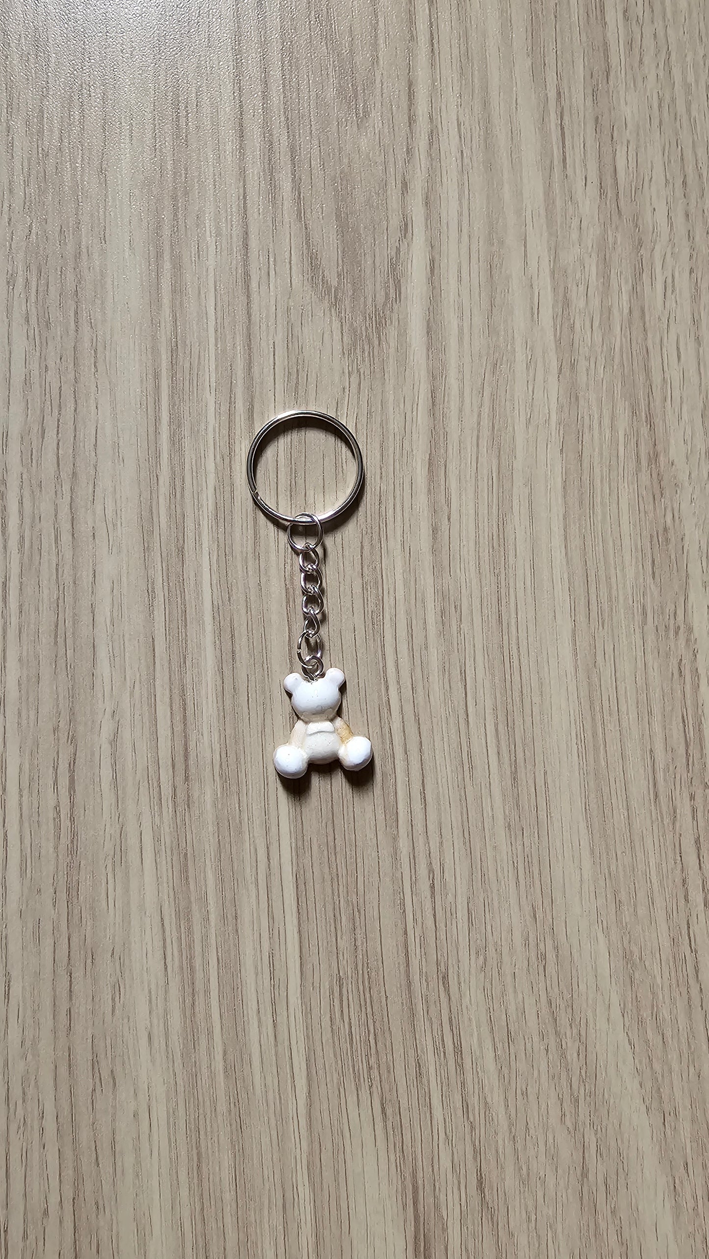 Petit porte clé ourson blanc et doré